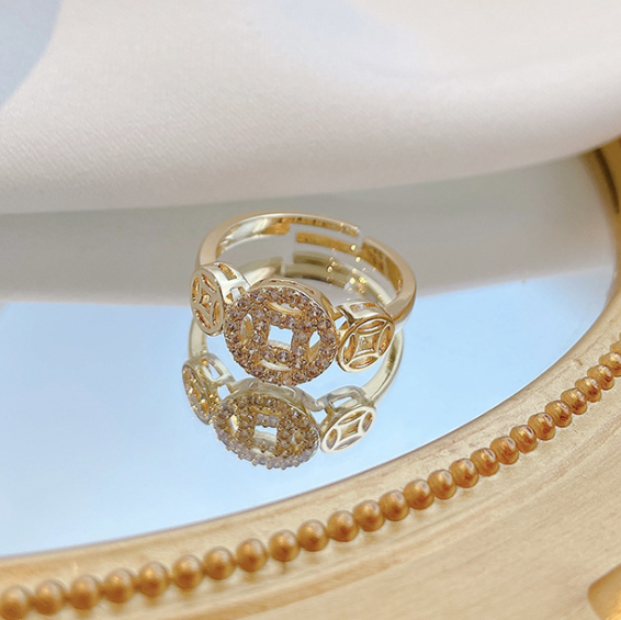 CHINESE WIND COPPER RING.
